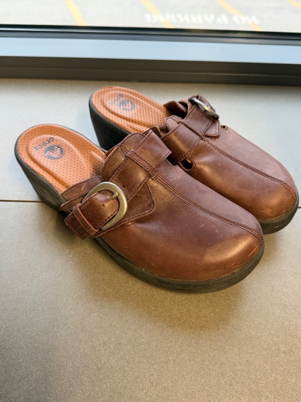 Crocs Cobbler Buckle Clogs in brown leather